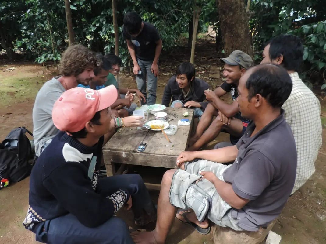 Sharing food around a wooden table